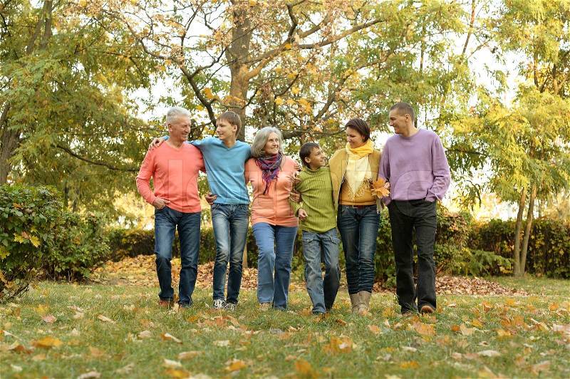 Walk a large family in the autumn forest, stock photo