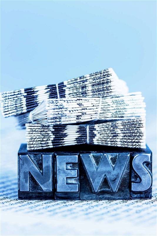 The word news written with lead letters. symbol photo for newsletters, newspapers and information, stock photo