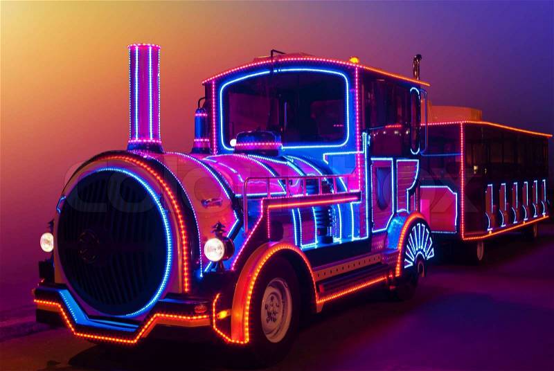 Fabulous, magical locomotive glow in the dark colored lights, stock photo