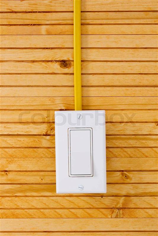 Electric switch on the surface of the wood panels, stock photo