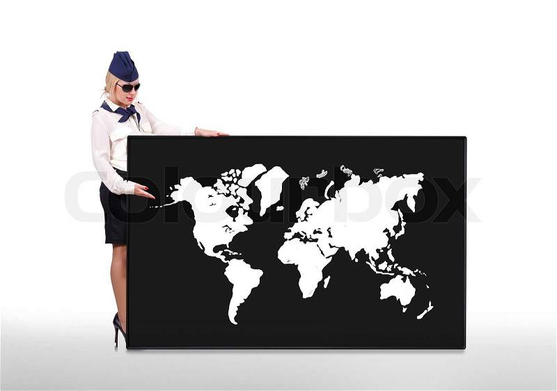 Stewardess holding blackboard with world map on white background, stock photo