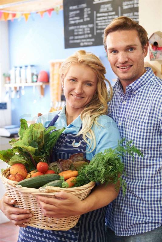 Portrait Of Couple Running Organic Food Shop, stock photo