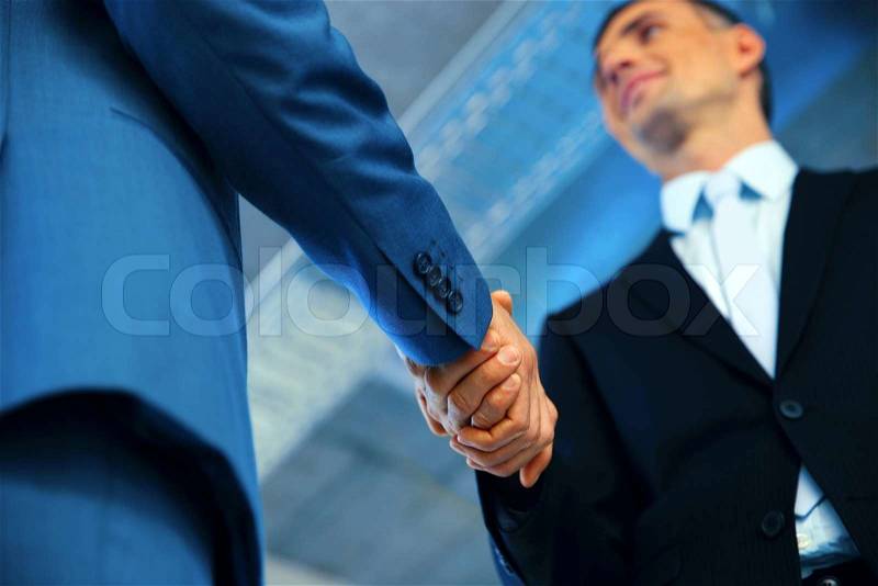Closeup of a business handshake, stock photo
