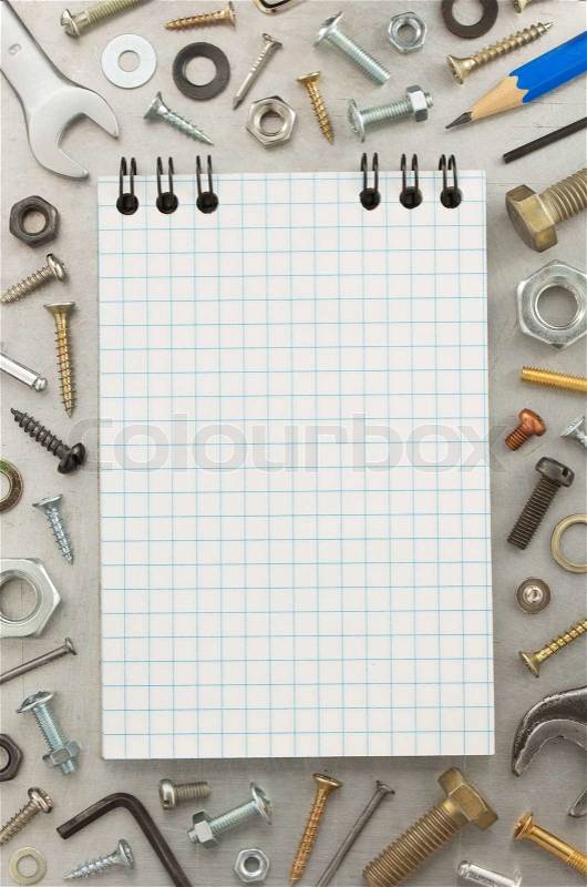 Hardware tools and notebook at metal background texture, stock photo