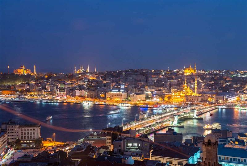 ISTANBUL - SEPTEMBER 17, 2014: City night panorama with Blue Mosque and Hagia Sophia on background. Istanbul is visited by more than 11 million people every year, stock photo