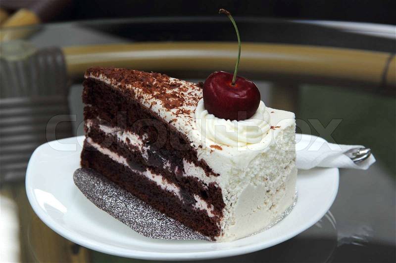 Black Forest Cake on the glass table , stock photo