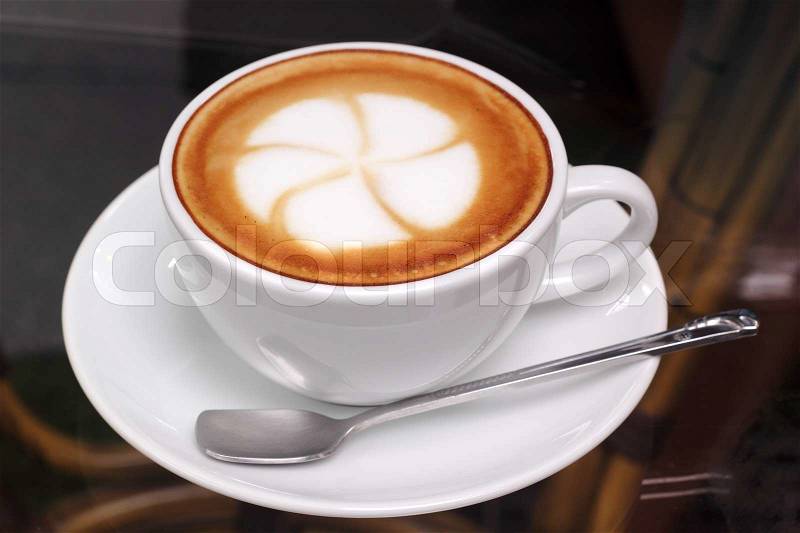 Flower on latte coffee art , stock photo
