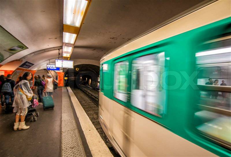 Pairs. Metro train speeding up in the subway, stock photo