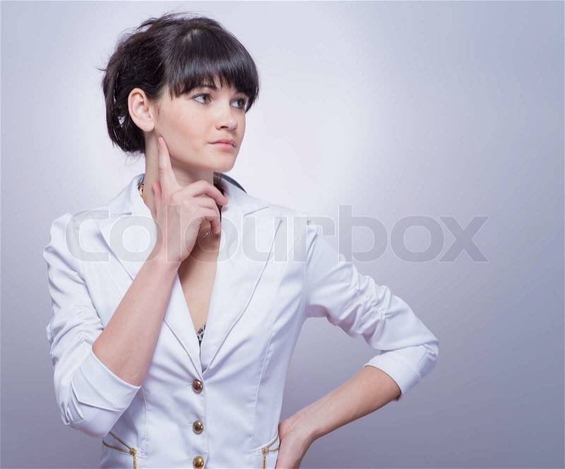Young business woman thinking, stock photo