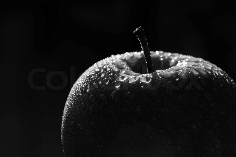 Close up picture of a green apple, black and white version, stock photo