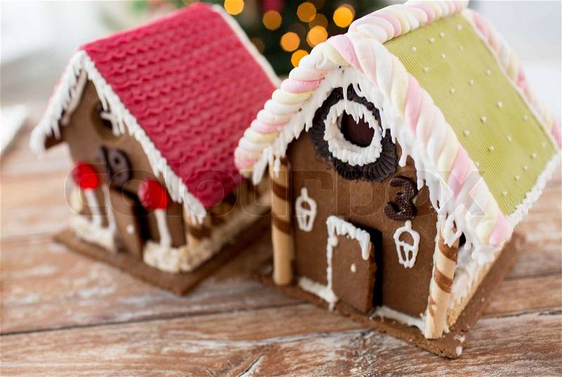 Holidays, christmas, baking and sweets concept - closeup of beautiful gingerbread houses at home, stock photo