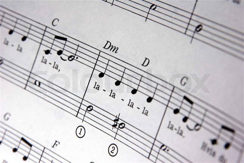 Music notes in opened music note book, stock photo