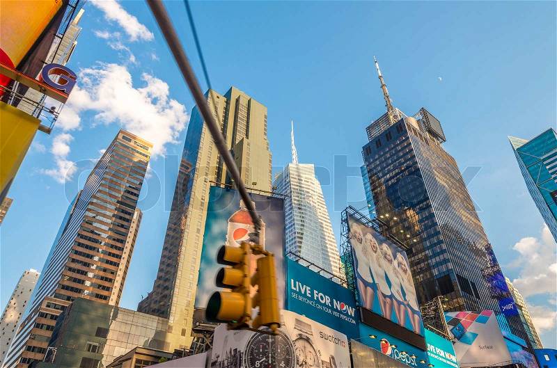 NEW YORK CITY - MAY 17, 2013: Ads and buildings of Times Square on a beautiful day, New York is visited by more than 50 million people annually, stock photo