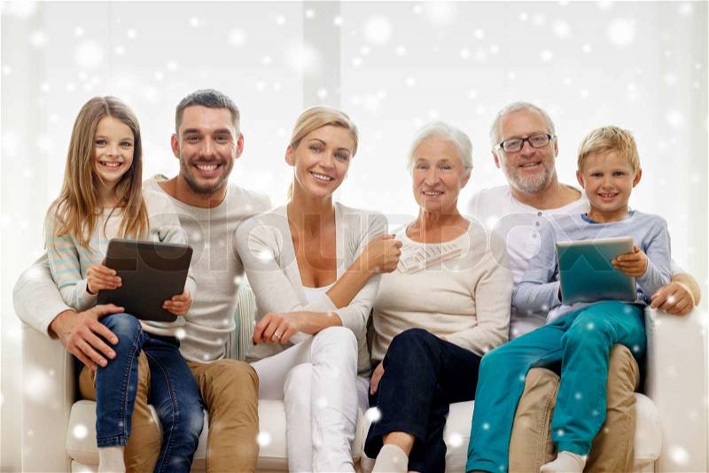 Family, generation, technology and people concept - smiling family with tablet pc computers at home, stock photo