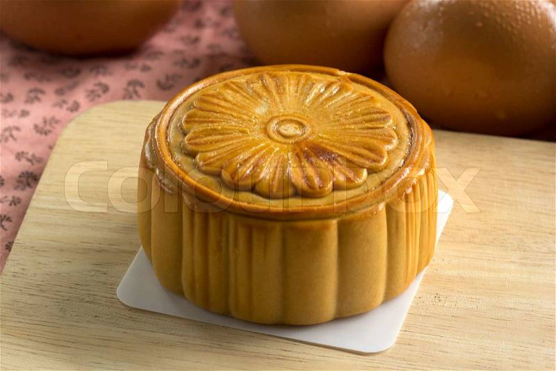 Moon cakes and egg background for the Chinese Mid-autumn festival , stock photo