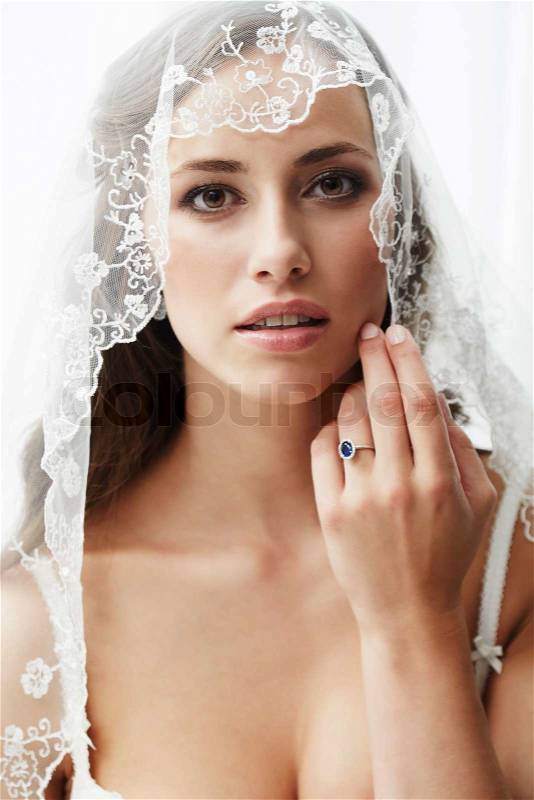 Young bride in wedding veil, studio shot \, stock photo