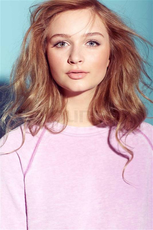 Strawberry blonde teenager in pink, portrait, stock photo