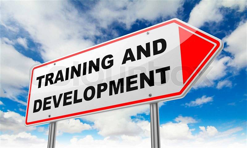 Training and Development - Inscription on Red Road Sign on Sky Background, stock photo