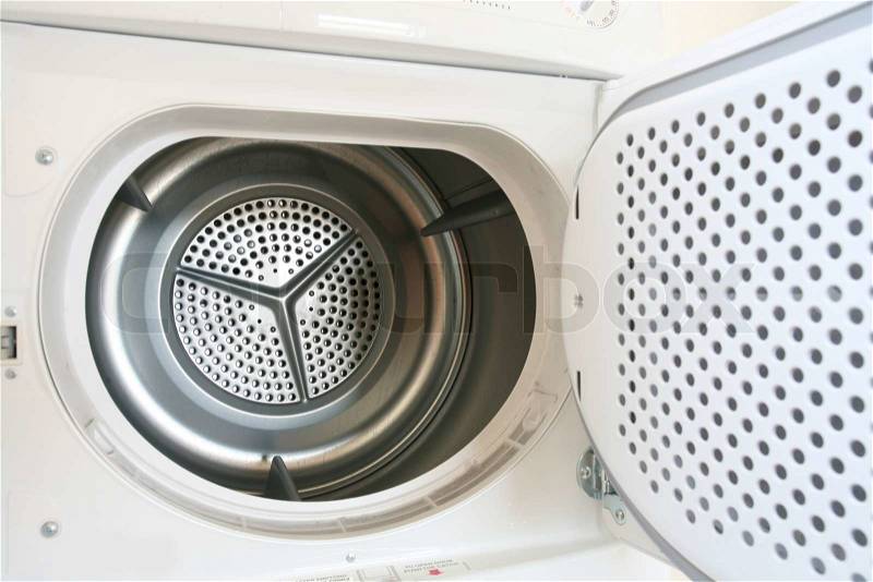 Washing machine closeup with opened round door, stock photo