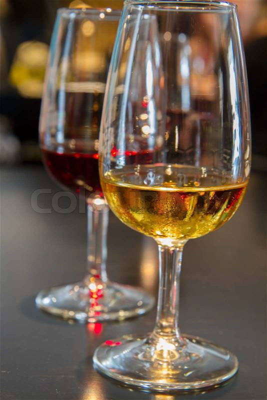 Set of glasses of white and ruby port wine, stock photo