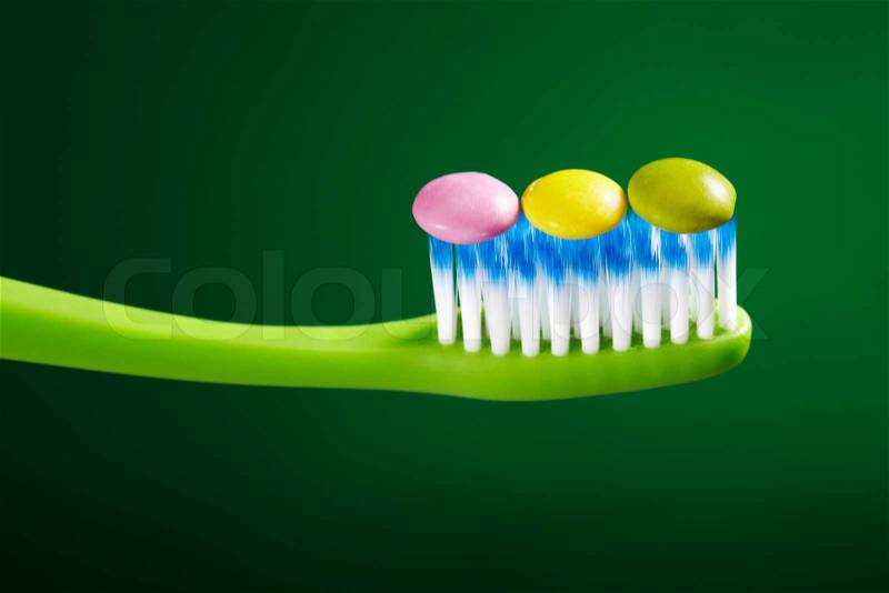 Tooth brush and candy, stock photo