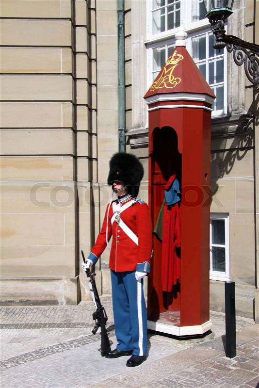 Royal guard in red at Amalienborg Palace Denmark, stock photo