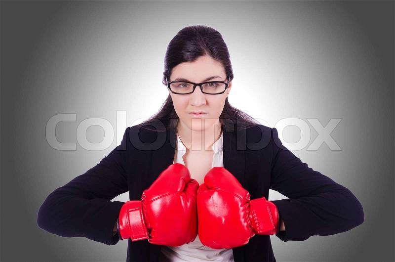 Woman businesswoman with boxing gloves on white, stock photo