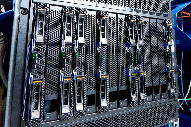 Detail of hard drive cluster in data center, stock photo