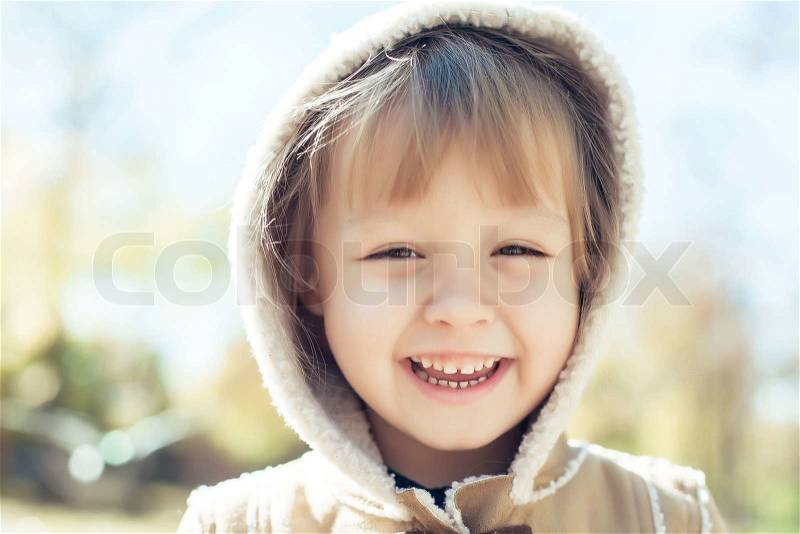Laughing face of baby girl, stock photo