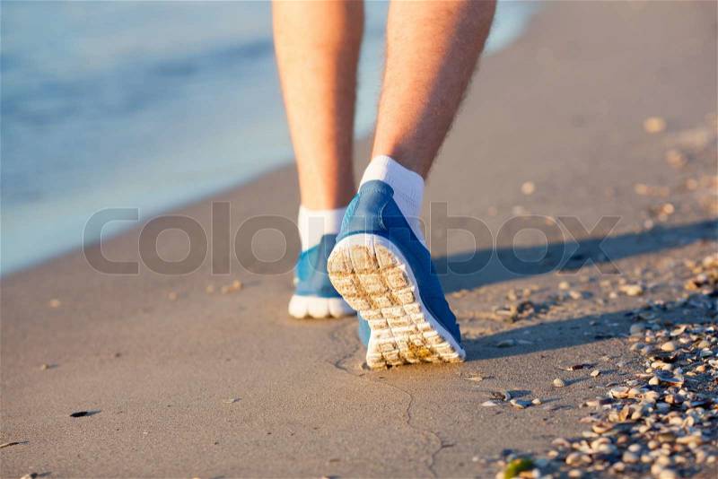 Athlete running in the sand feet, stock photo