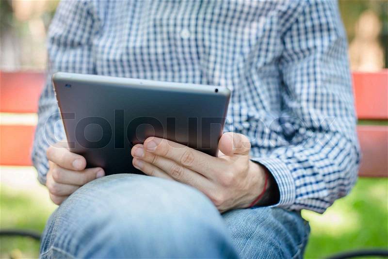 Businessman using touch pad of tablet pc, stock photo