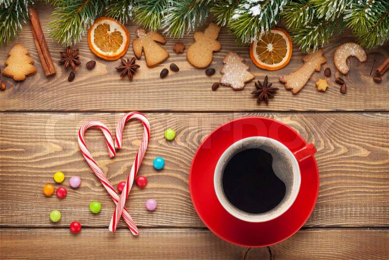 Coffee cup and christmas food decor on wooden table background, stock photo