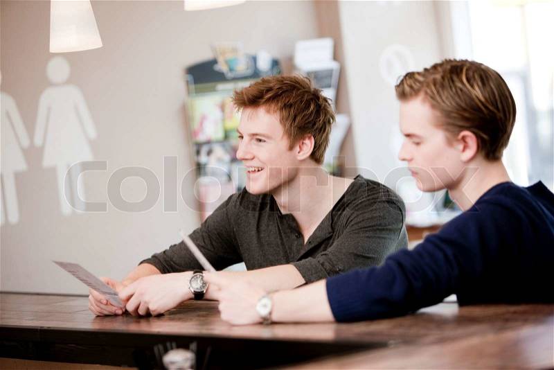 Two male caucasians in a cafe/restaurant, stock photo