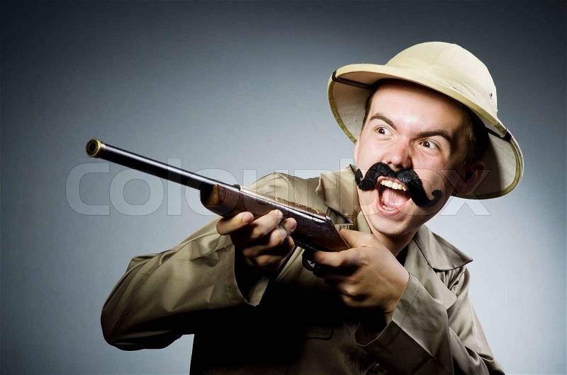 Man in safari hat in hunting concept, stock photo