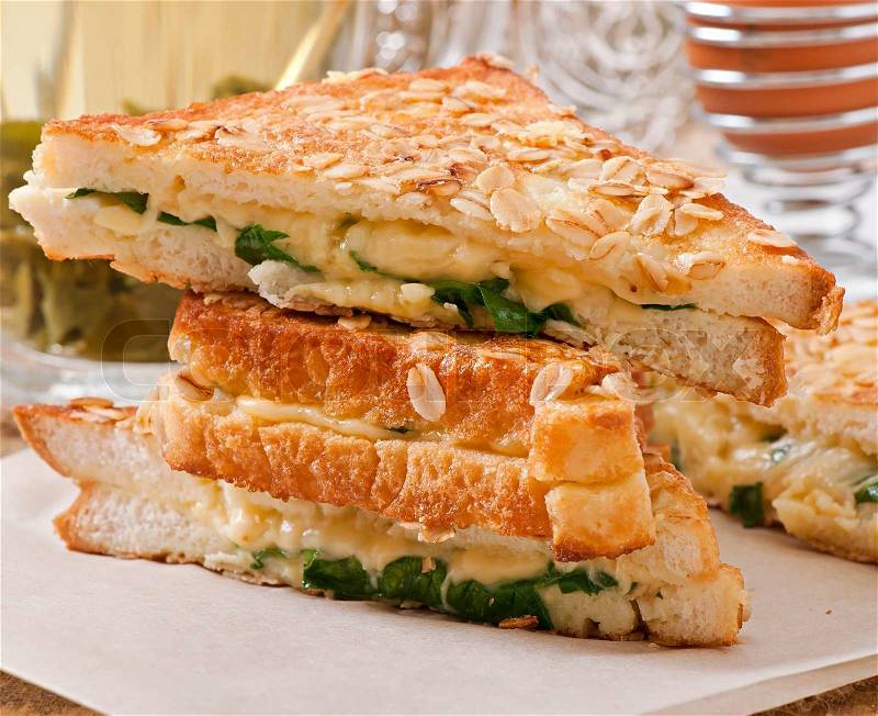 Warm toast with cheese and spinach for breakfast, stock photo