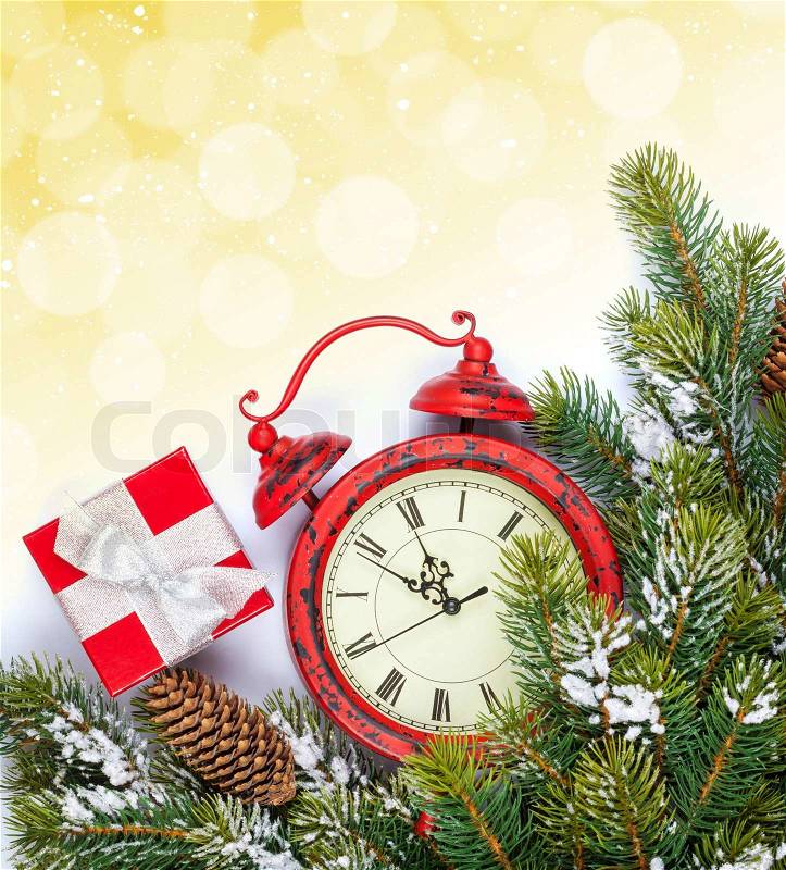 Christmas background with clock, gift box, snow fir tree and copy space with bokeh, stock photo