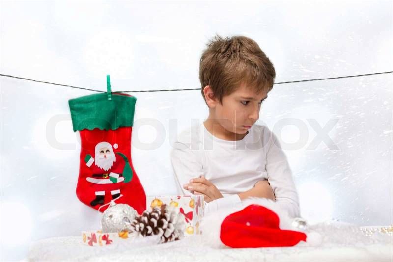 Portrait of sad boys with Christmas decorations, stock photo