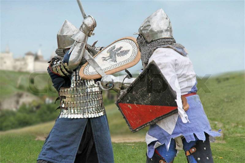 Knight duel near a castle, stock photo