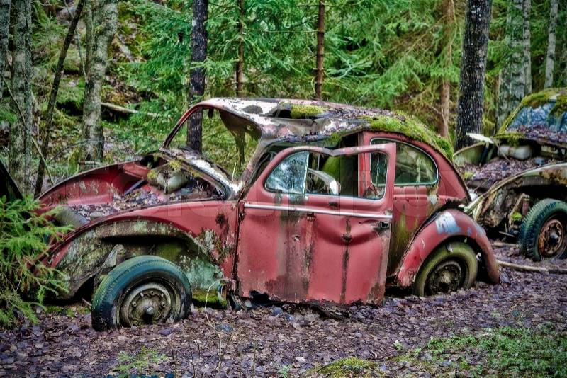 Abandoned VW left in the nature near the Norwegian border - Sweden. From the series Scrap in the wood, stock photo