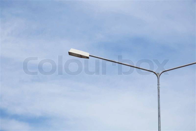 Lamp post lighting Behind the sky is covered with clouds, stock photo