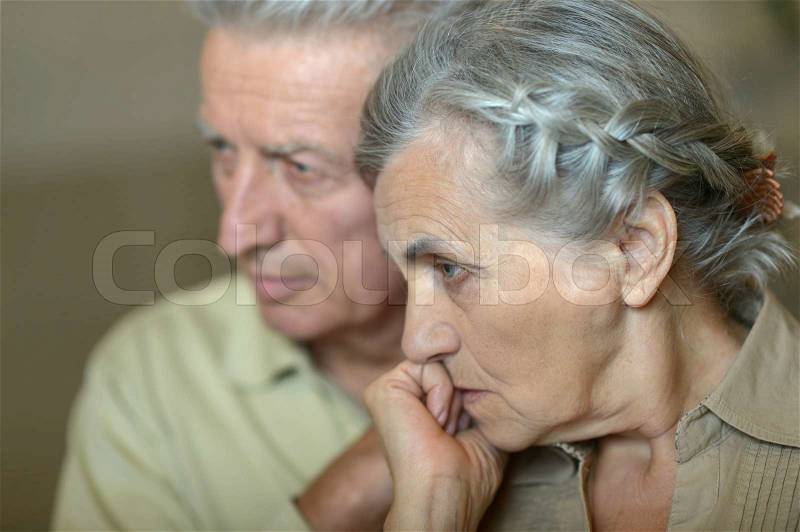 Portrait of ill senior couple close up, stock photo