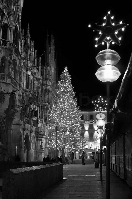 Christmas tree at night with lights. Marienplatz in Munich , Germany. (Black and White), stock photo