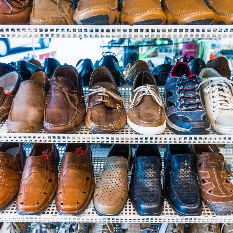 Lots of shoes on sale. Diverse shoes, stock photo