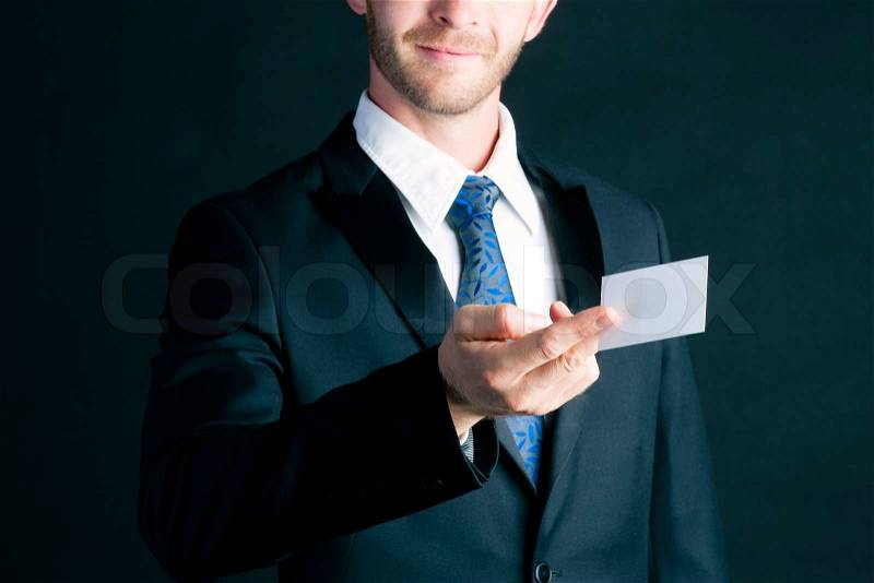 Business man or manager in suit hand over empty business card to socialize , stock photo