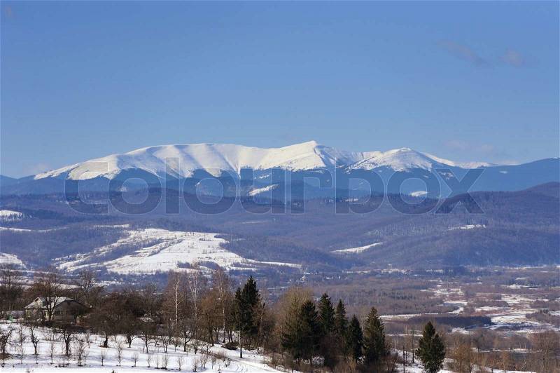 Snow on the top of mountain. Spring time, stock photo