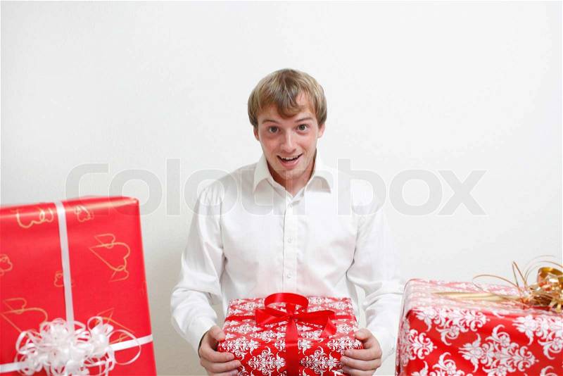 A man excited to have received a Christmas present, stock photo