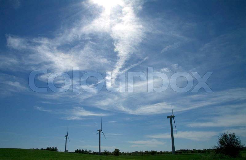 Dramatic sky with wind turbines, stock photo