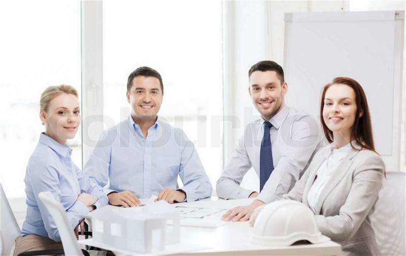 Business, architecture and office concept - happy team of architects and designers in office, stock photo