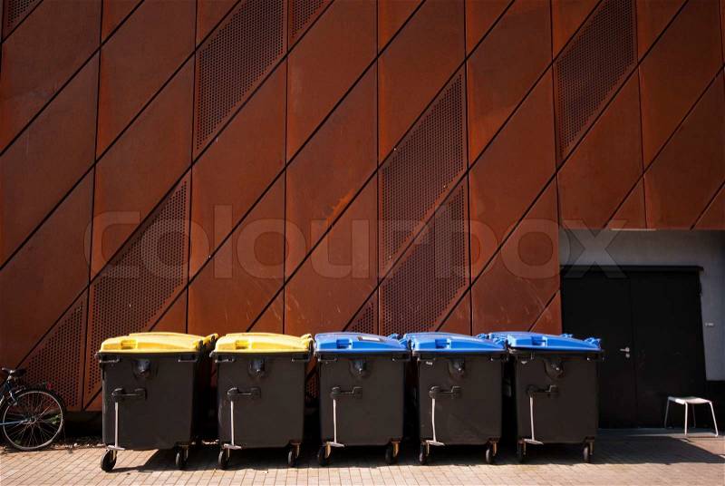 Rusty facade and garbage bins - Part of University Science Centre - Museum in Bremen, Germany, stock photo