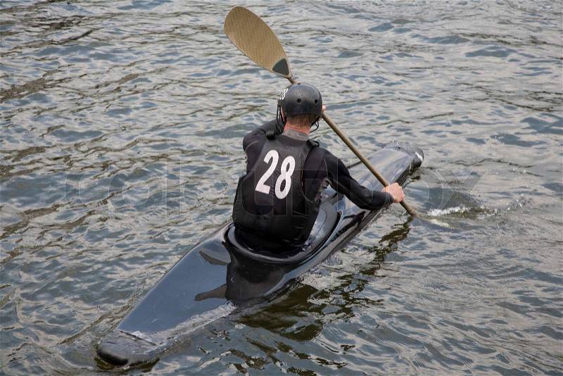 Canoe polo or kayak polo player in the harbour of Odense, Denmark ready for match, stock photo